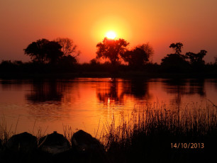 Sonnenuntergang am Okawango Delta (Foto: Olivier D'Haenens)